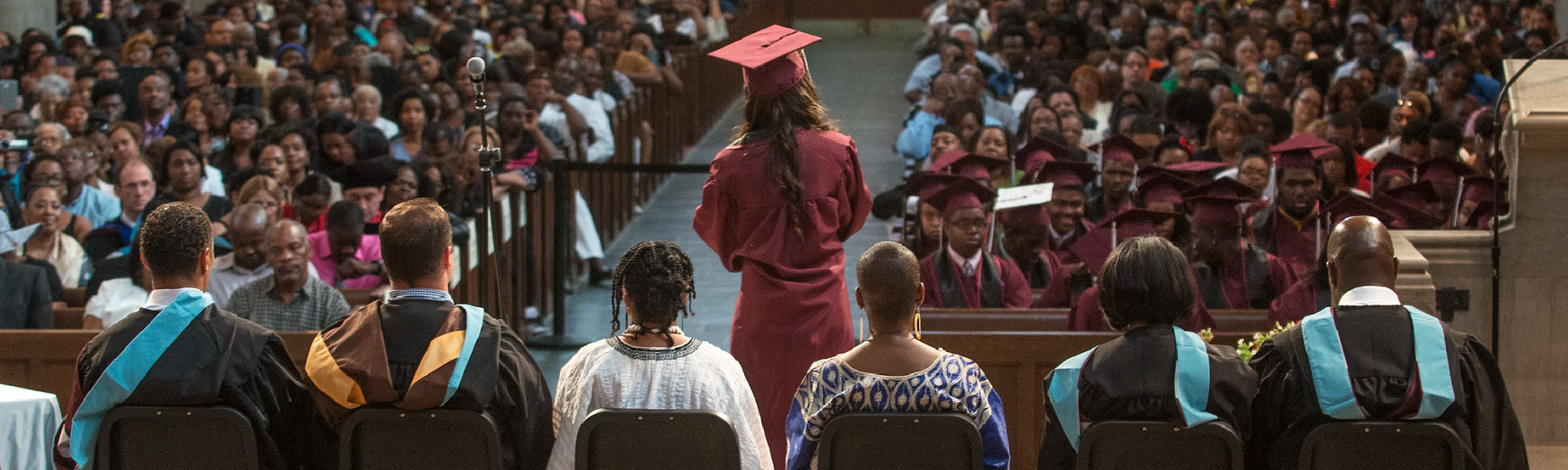 A high school senior gives her graduation speech at the ceremony